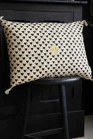 Lifestyle image of the Monochrome Heart & Gold Clover Cushion