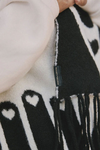Close-up image of the Monochrome Printed Hands Scarf
