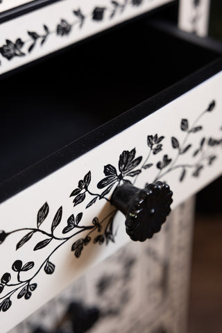 Close-up of an open drawer/handle on the Monochrome Rose Noir Chest Of Drawers.