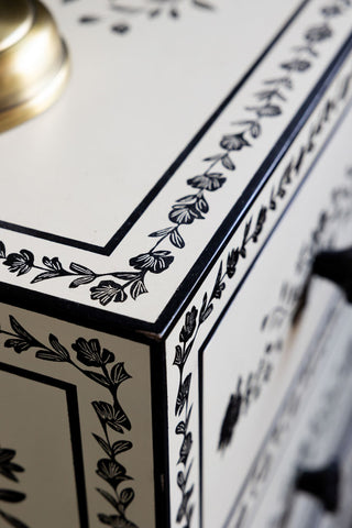 Close-up of the corner of the Monochrome Rose Noir Chest Of Drawers.