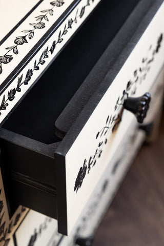 Close-up of of an open drawer from the Monochrome Rose Noir Chest Of Drawers.