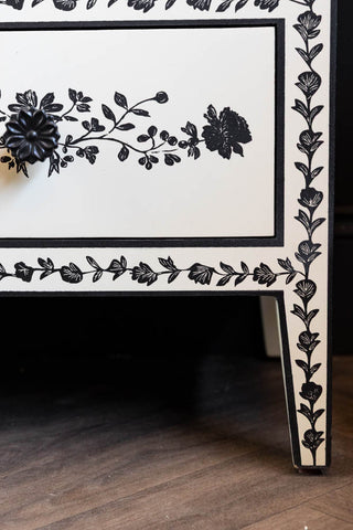 Close-up of the feet of the Monochrome Rose Noir Chest Of Drawers.