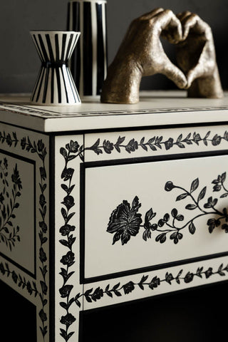 Close-up of the corner of the Monochrome Rose Noir Console Table.