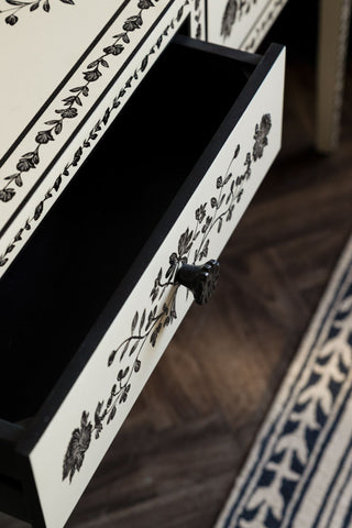 Close-up of an open drawer on the Monochrome Rose Noir Console Table.