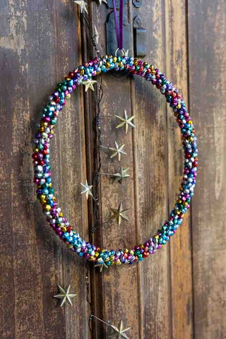 Lifestyle image of the Multicoloured Mini Bell Christmas Wreath