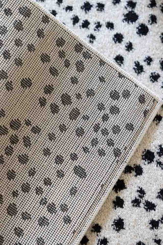 Image of the underside of the Muse Monochrome Dalmatian Spot Rug  - 2 Sizes Available