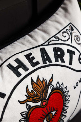 Detail showing the embroidered typography of the My Heart Monochrome Embroidered Cushion. 