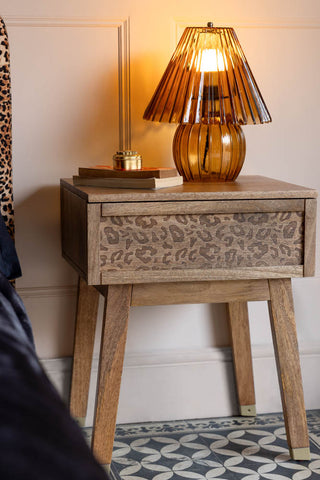 Lifestyle image of the Natural Leopard Print Bedside Table