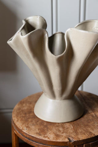 Detail image of the natural pleats of the sage green decorative vase