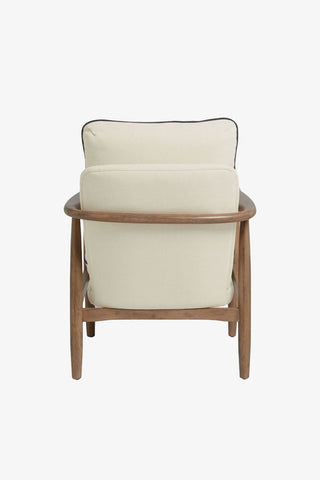 Natural armchair with cushioned seat and backrest seen from the back, on a white background.