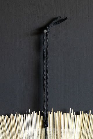 Image of the Natural & Black Fan Wall Decoration on a wall