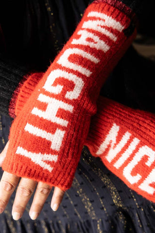 Close-up of the Naughty or Nice Handwarmers being worn by a model.