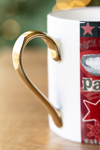 Close-up of the goldh handle on the Never Mind The Baubles Mug.