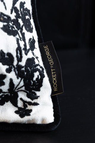 Image of the logo on the Normal Is Boring Embroidered Rectangular Cushion