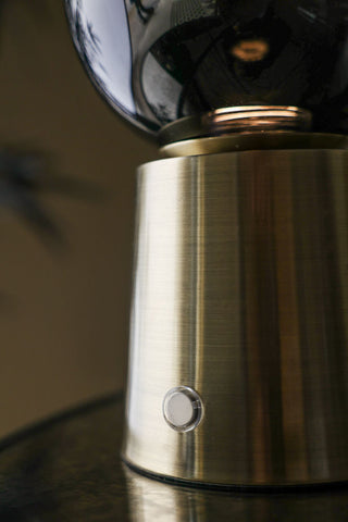 Close-up of the button on the Ombre Orb Rechargable USB Table Light