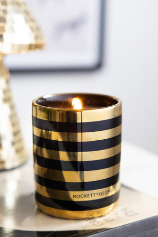 The Ooh La La Berry & Sandalwood Scented Candle lit.