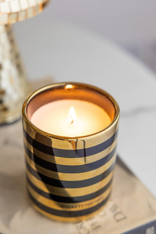Close-up of the lit Ooh La La Berry & Sandalwood Scented Candle.
