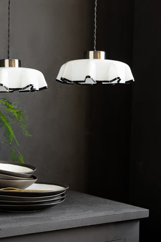 Image showing two of the Monochrome Pleated Glass Easyfit Ceiling Light Shades shown in a kitchen against black walls. 