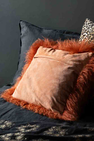 Image of the back of the Orange Mongolian Sheepskin Suede Cushion