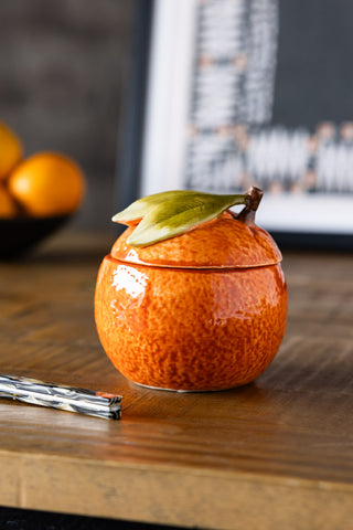 Image of the Orange Storage Jar on a table