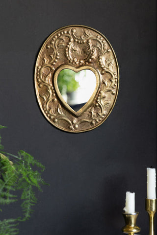 Lifestyle image of the Ornate Bronze Metal Heart Mirror