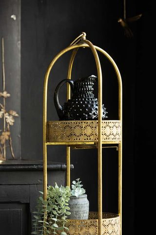 Detail image of Ornate Gold Tall Tray Shelves, styled with plants and home accessories. 