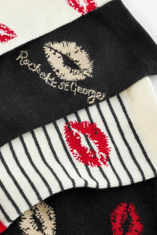 Close up image of the Pack Of 4 Lips Printed Socks, showing the lipstick kisses woven into each design. 
