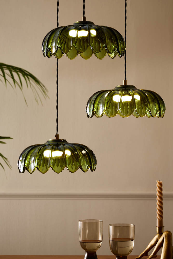 three hanging green and gold palm lights