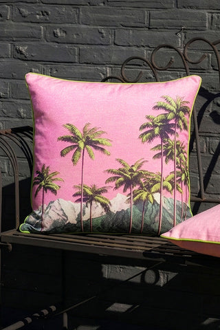 The Palm Springs Outdoor Cushion styled on an outdoor bench.