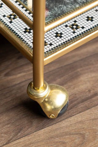 The Party People Only Gold Drinks Trolley, detail of the wheel and tile design.
