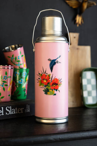 Lifestyle image of the Pink Painted Bird Decorative Flask