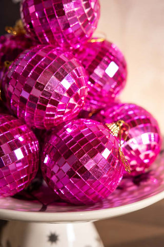 Close-up of several Pink Disco Ball Christmas Tree Decorations.