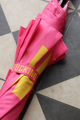 Image of the Pink Fucking Rain Umbrella folded up