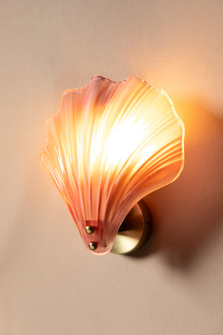 Close up of the Stunning Pink Glass Shell Wall Light with the light on