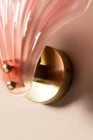 Detail of the Stunning Pink Glass Shell Wall Light, showing the gold base