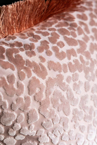 Close-up of the design on the Blush Pink Leopard Velvet Cushion with Fringe Trim.