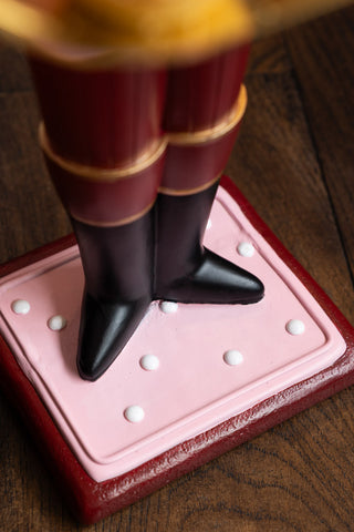 Close-up of the base of the Pink Nutcracker Butler Christmas Decoration.