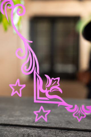 The printed frame detailing on the Pink Ornate Print Frame Mirror. 