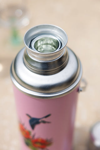 Close-up of the top of the Pink Painted Bird Decorative Flask.