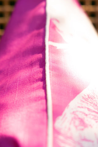 Close-up of the piping on the Pink Palm Tree Outdoor Cushion.