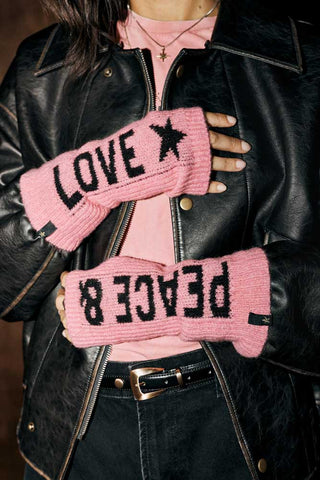The Pink Peace & Love Handwarmers shown worn with a pink t-shirt, black leather jacket and black jeans. 