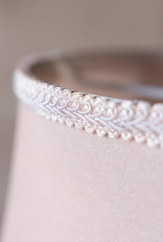 Close-up of the trim on the edge of the Pink Poodle Table Lamp.