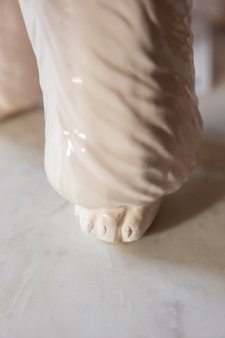 Close-up of the feet of the Pink Poodle Table Lamp.