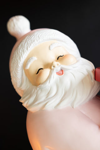 Close-up of the face of the Pink Santa Butler Christmas Decoration.