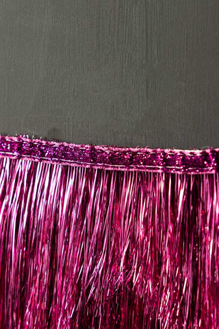 Close-up of the edge of the Pink Scalloped Tinsel Garland.