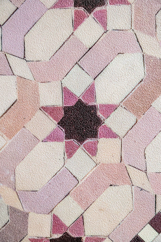 A close up showing the star pattern and the pink and burgundy palette of the Pink Star Durable Floor Mat.