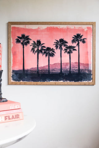 Lifestyle image of Pink Sunset A2 Art Print in a natural frame on a light background.