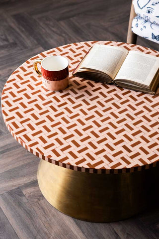 The Pink & Caramel Inlay Coffee Table seen from above, styled with a mug and book on.