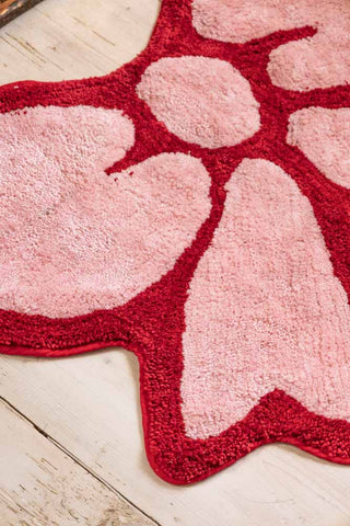 Close-up image of the Pink & Red Bow Shape Rug