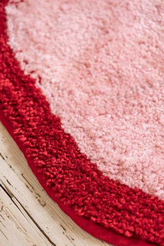 Detail image of the Pink & Red Bow Shape Rug